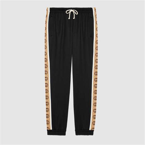 fake gucci logo jogging pants|gucci side stripe track pants.